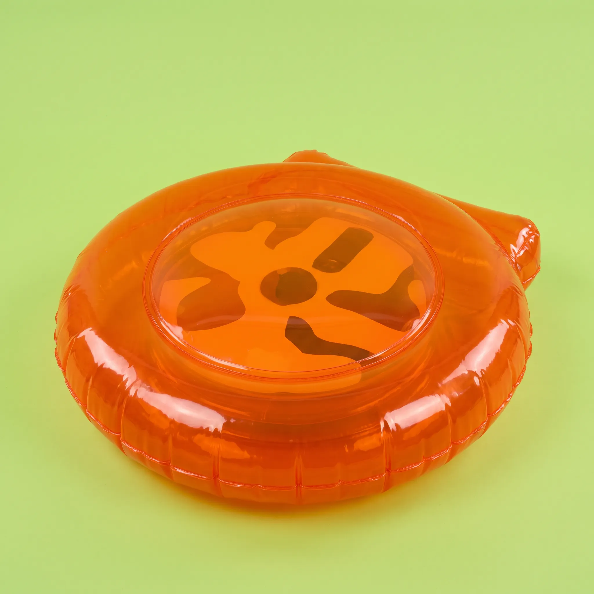 Inflatable vinyl sculpture of a translucent tangerine portable CD player, Y2K art style