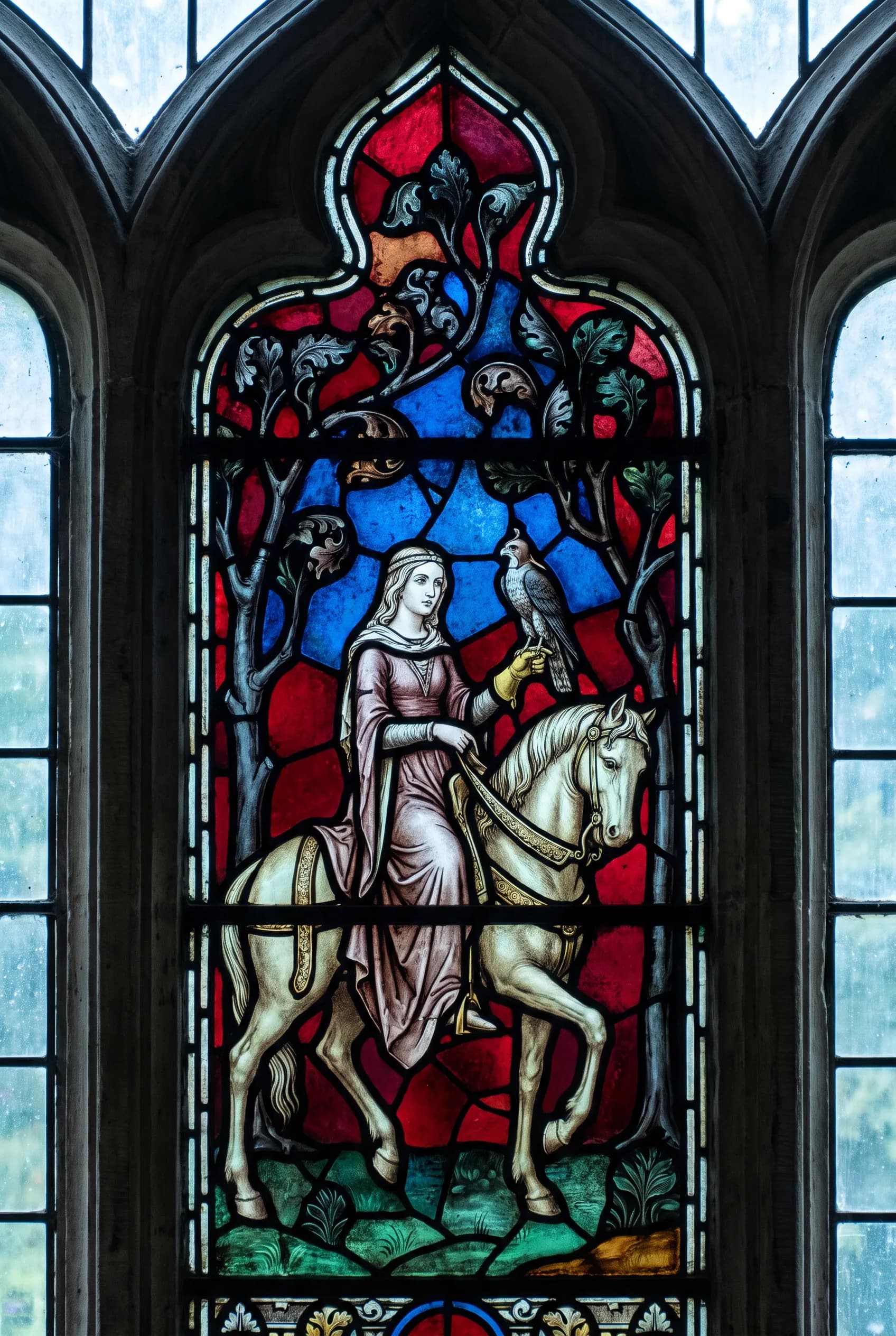 Gothic stained glass window of a noblewoman falconer on a white horse, medieval art style