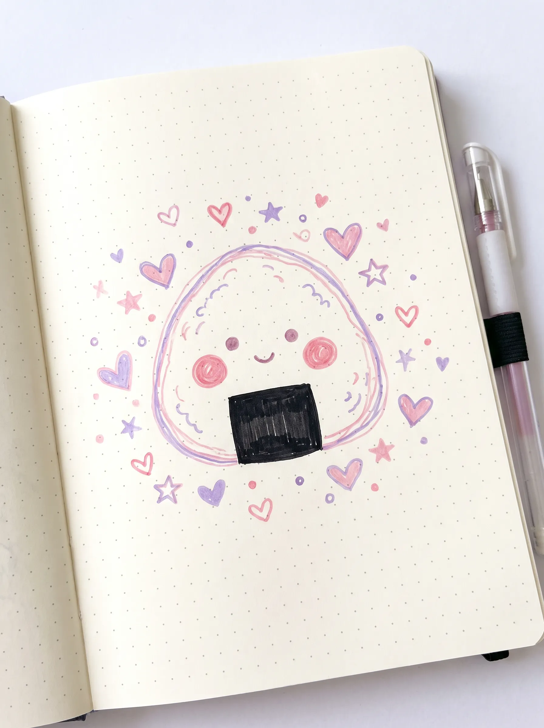 Gel pen notebook doodle of a round onigiri rice ball mascot with hearts and stars, kawaii art style
