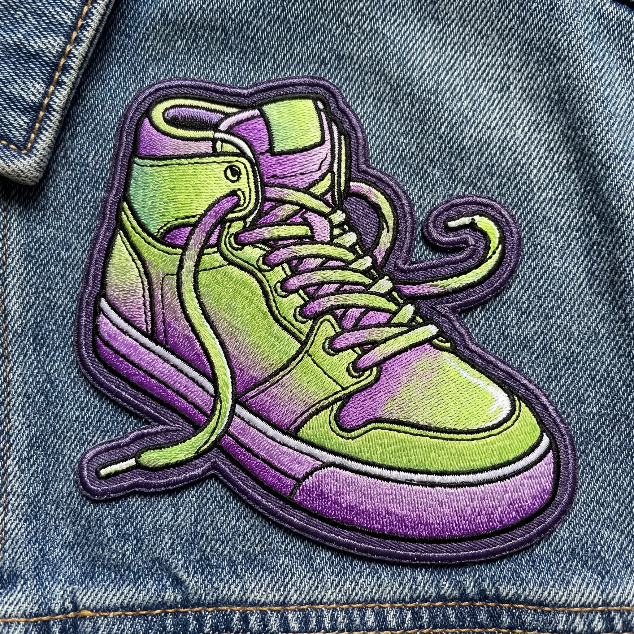 Embroidered patch of a chunky high-top sneaker with stitched fades, graffiti art style