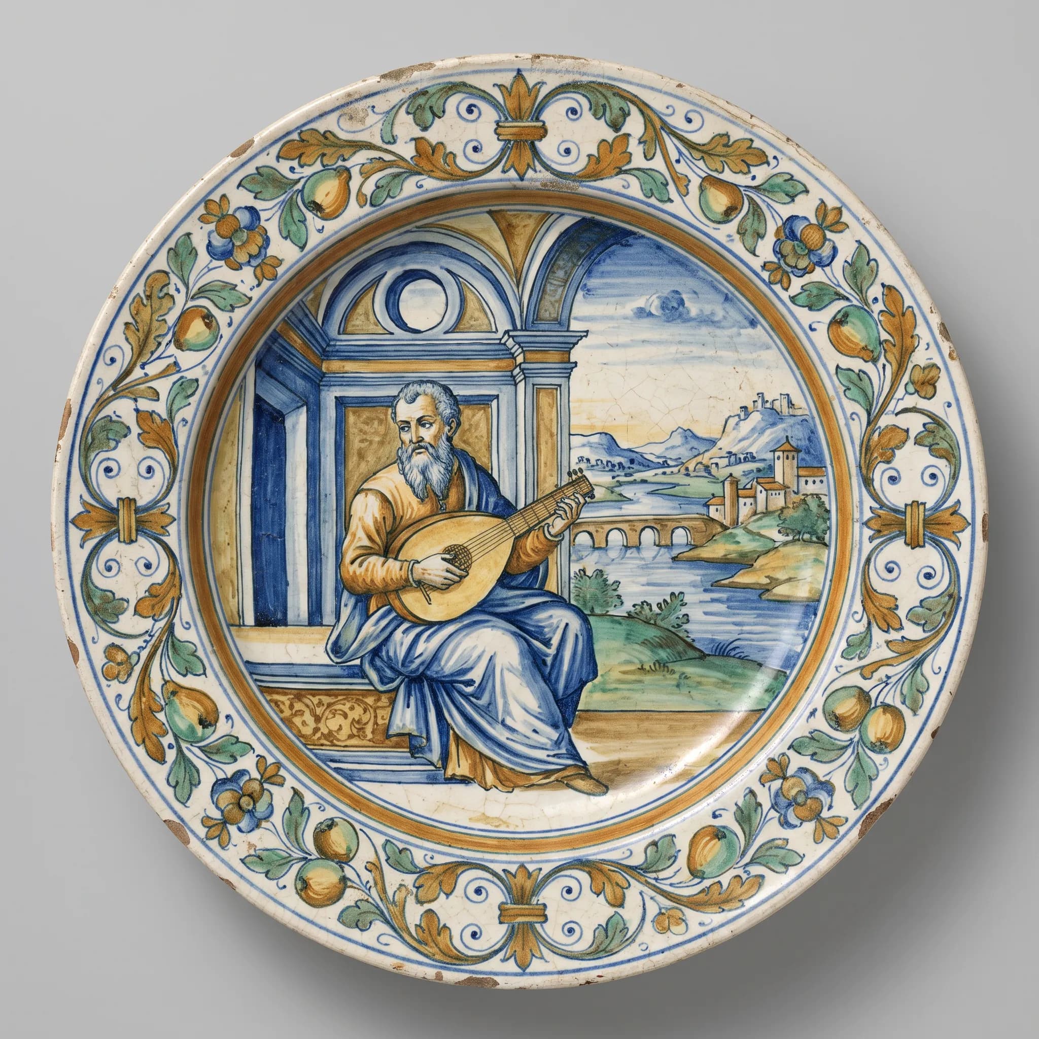Tin-glazed majolica plate painted with a bearded lute player, renaissance art style