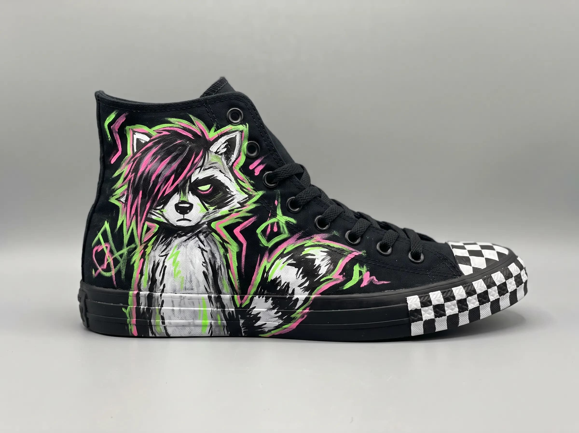 Hand-painted high-top sneaker showing a raccoon with a pink-streaked fringe, scene art style