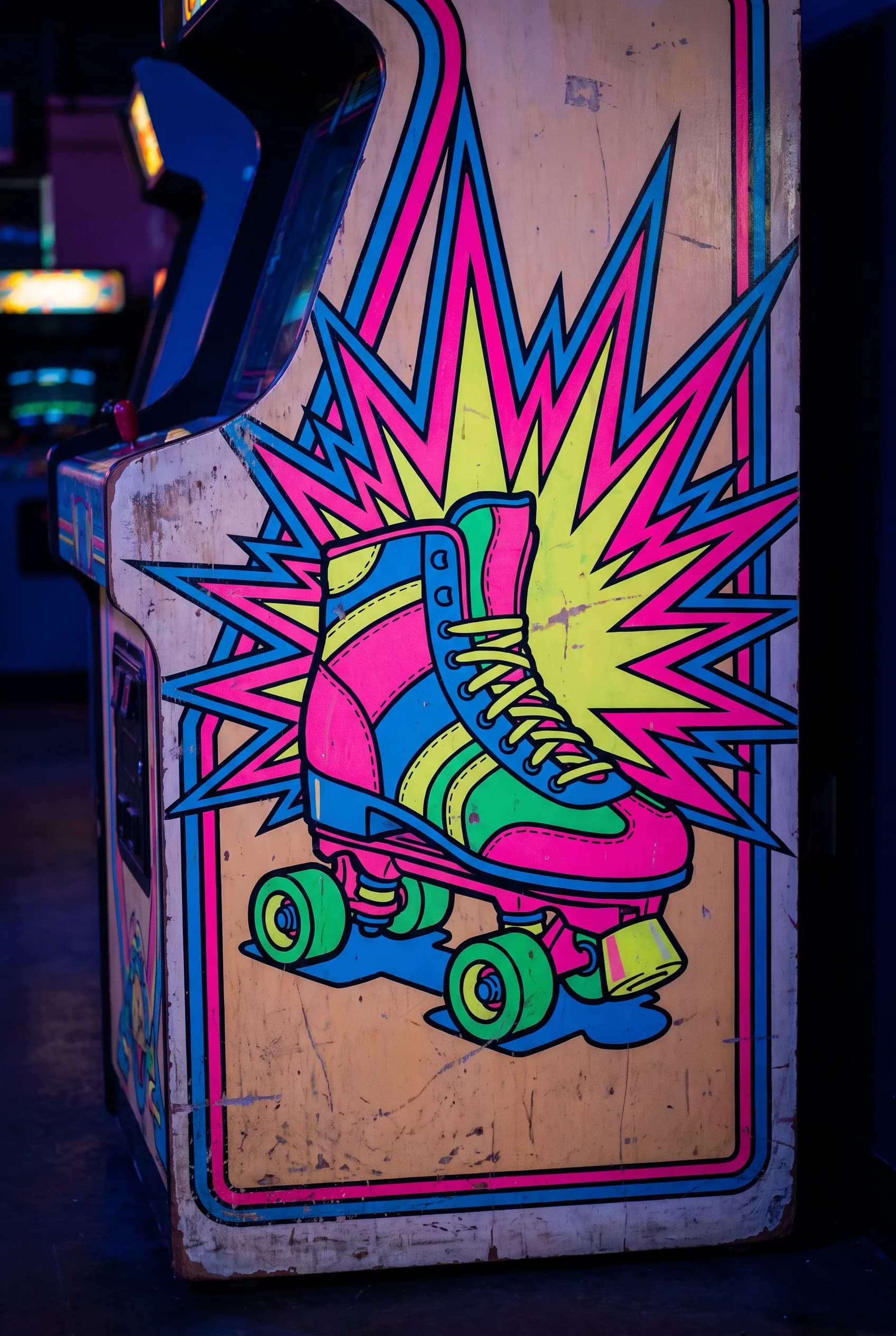 Arcade cabinet side art of a roller skate with a neon starburst, 80s art style