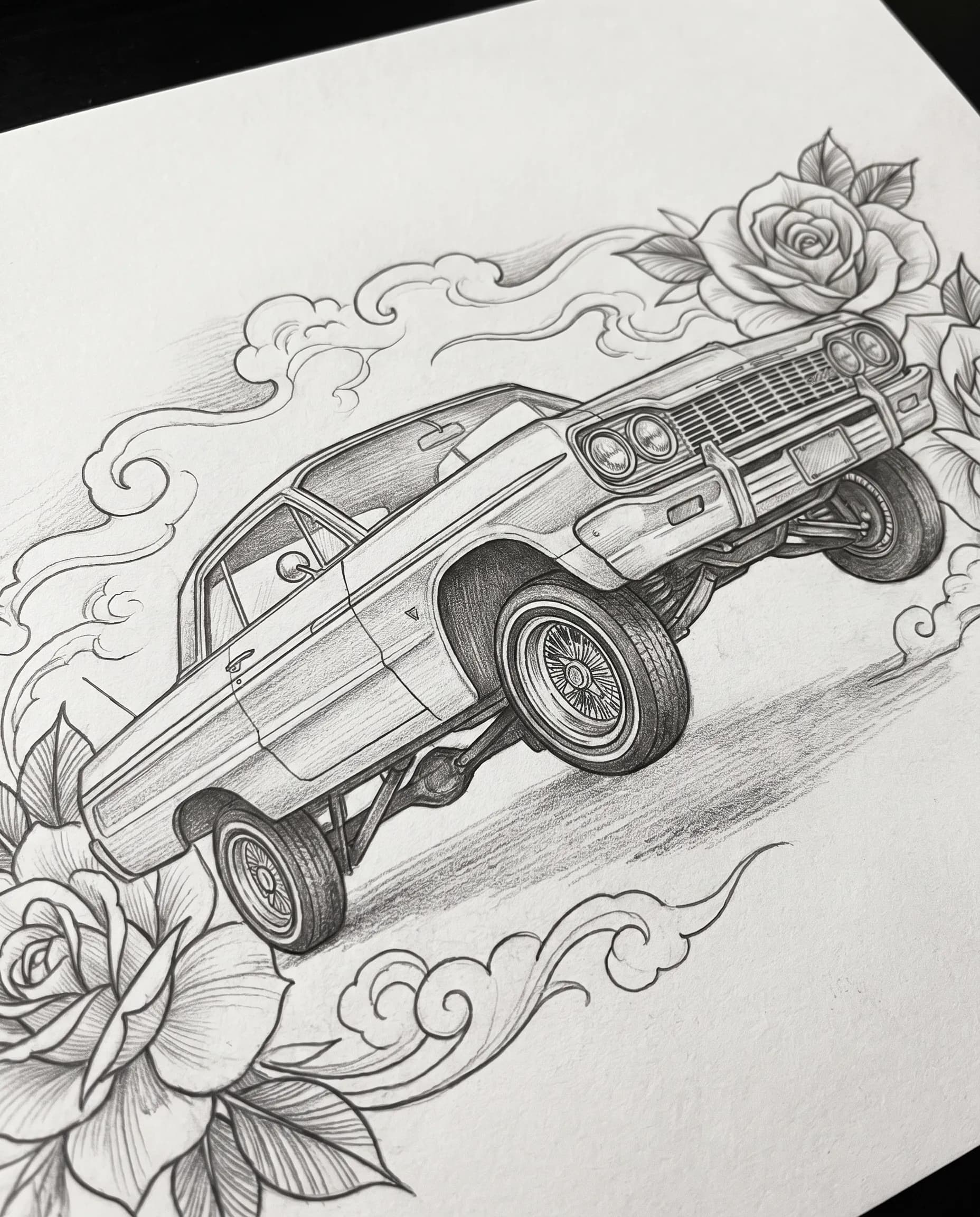 Fine-line black-and-gray drawing of a lowrider sedan framed by roses and clouds, Chicano art style