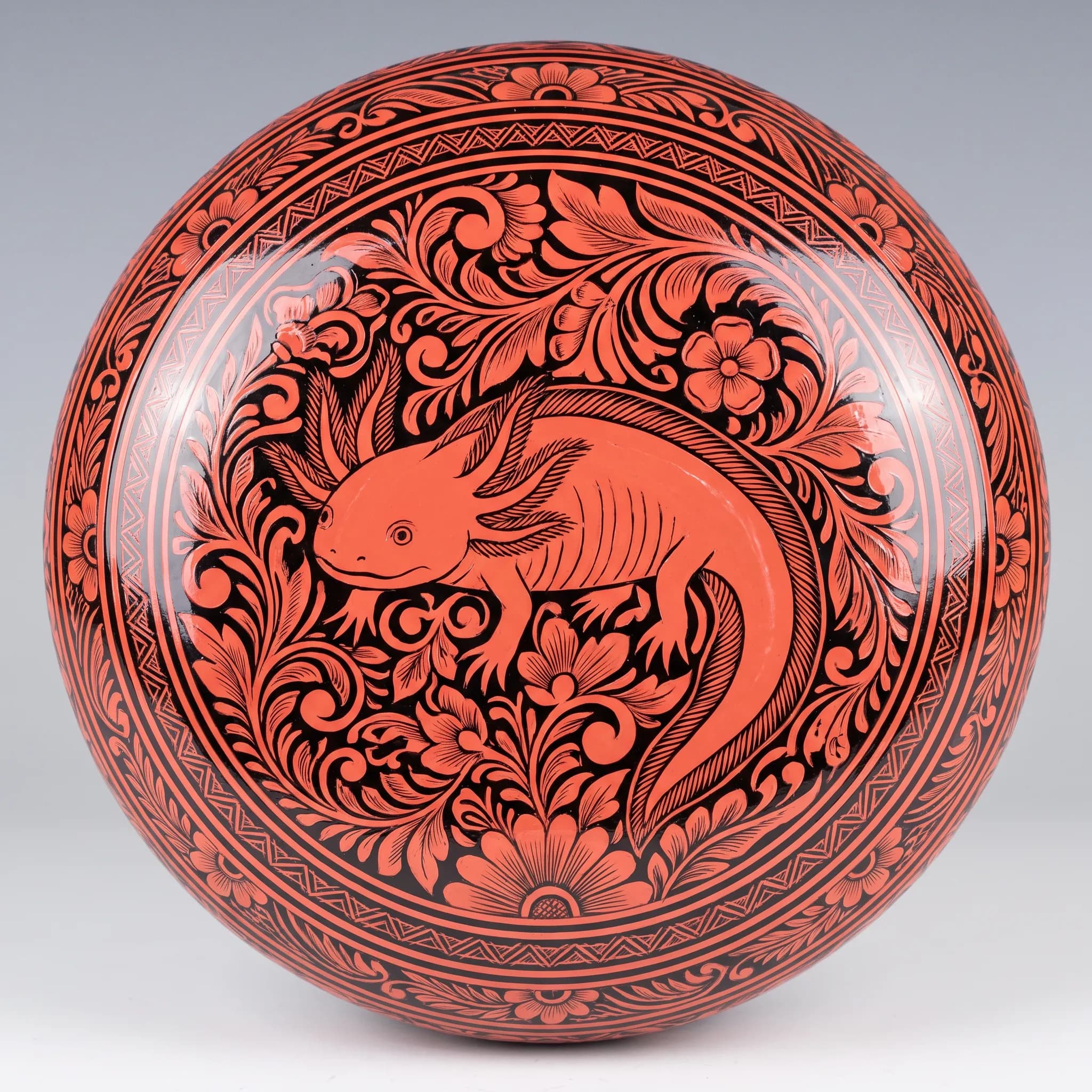 Olinalá lacquer box lid with an axolotl in the rayado technique, Mexican lacquerware style
