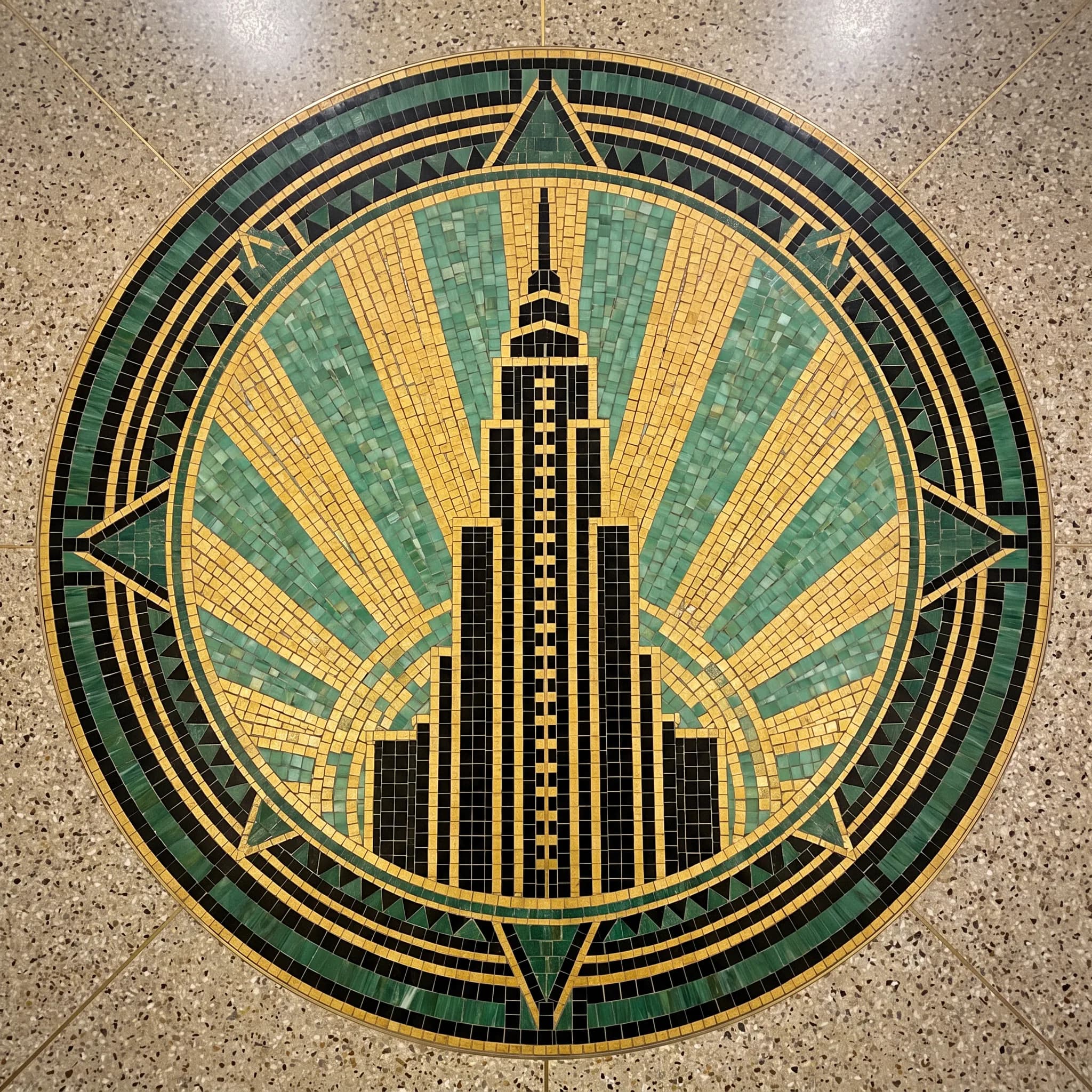 Terrazzo and mosaic floor medallion of a hotel tower in art deco style